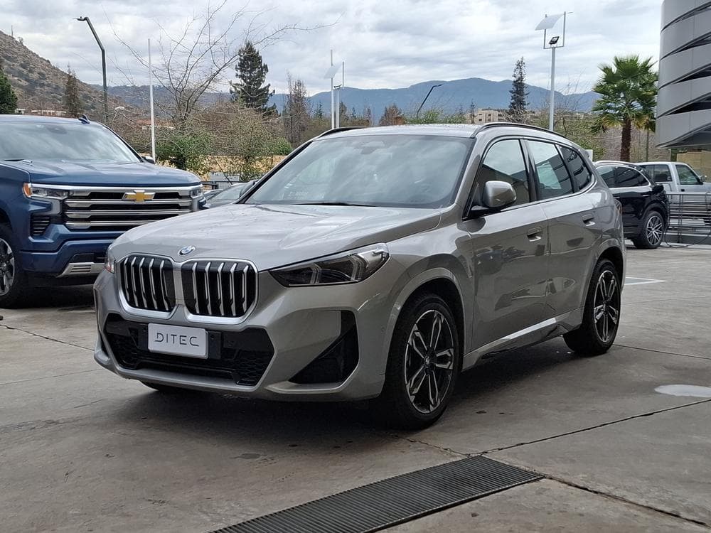 Grey BMW photographed on a dealership forecourt